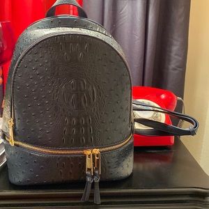Navy blue backpack with matching wallet